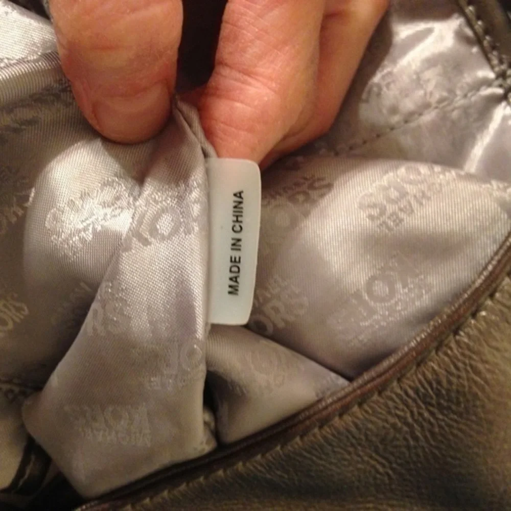 Michael Kors silver metallic hobo bag buckle